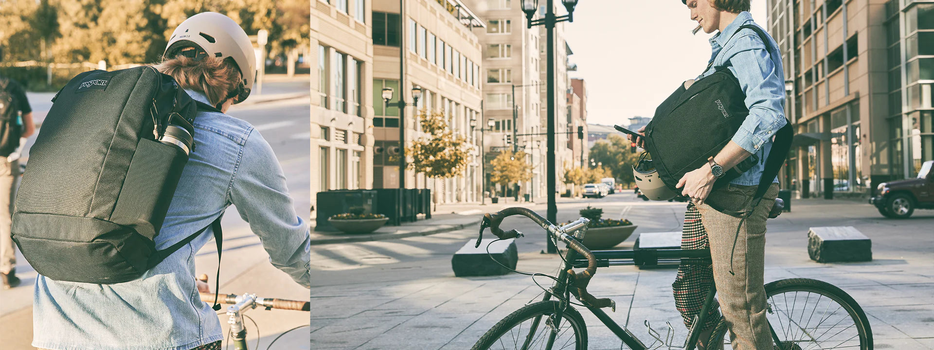 Person with a large black backpack walking on a city street, with another person sitting on a bike nearby.