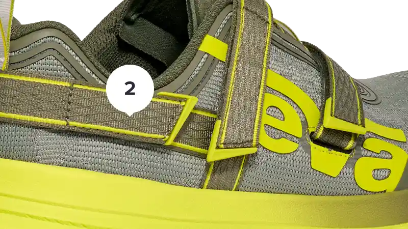 Gray and yellow trail shoe with 'Teva' branding on a white background