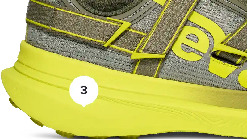 Close-up of a running shoe with a focus on the sole and brand logo.